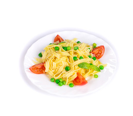 Pasta with green peas on plate.