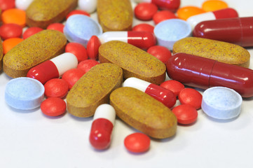 colorful medical therapy with different tablets, and pills