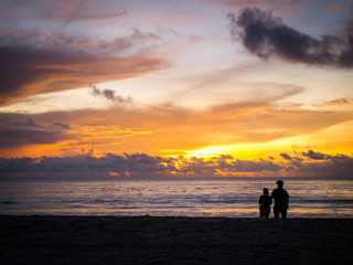 Two people in love at sunset on the beach