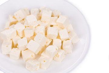 Tofu cheese on white plate.