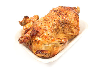 Whole roasted chicken isolated on white