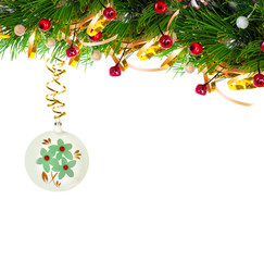 Christmas tree branch with gold serpentine and vintage sphere on