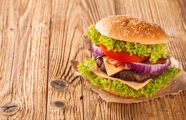 Fresh hamburger on wooden planks