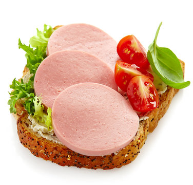 Fototapeta sandwich with sliced sausage