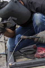 welder worker welding metal
