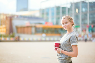 Young beautiful woman having her coffee break