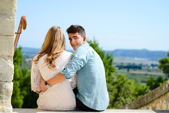 happy young couple teenager first love together in summertime