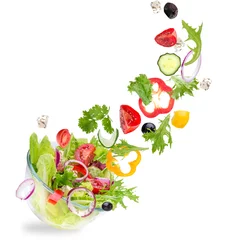 Poster Im Rahmen Fresh salad with flying vegetables ingredients © Lukas Gojda