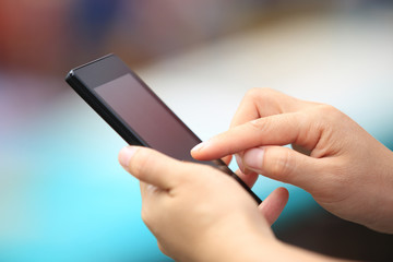 young woman hands use cellphone in city 