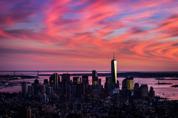 Aerial view of lower Manhattan in wild pink colors of sunset