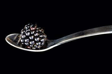 Single Blackberry on a spoon