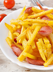 Fried potatoes with sausage on a plate