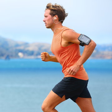 Running app on smartphone - male runner