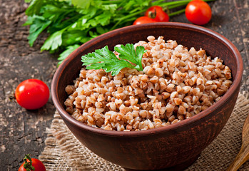 Buckwheat porridge in an old ceramic bowl on a rustic style