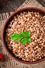 Buckwheat porridge in an old ceramic bowl on a rustic style
