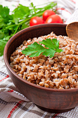 Buckwheat porridge in an old ceramic bowl on a rustic style