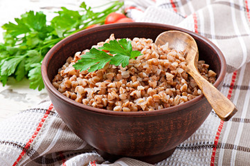 Buckwheat porridge in an old ceramic bowl on a rustic style