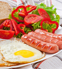 English breakfast - sausages, eggs, beans and salad