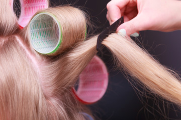 Female blond hair head curlers rollers hairdresser beauty salon