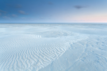 sand dunes on North sea coast during sunrise