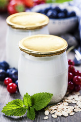 Obraz na płótnie Canvas Healthy breakfast - yogurt with muesli and berries