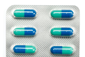 Pack of green vitamins, isolated. Healthcare concept.