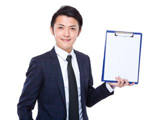 Young businessman show a blank paper of clipboard