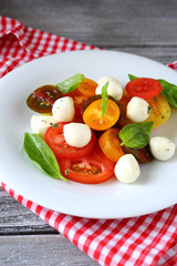 Caprese salad on white plate