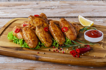 fried chicken wings with red sauce