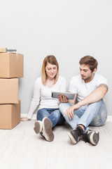 Smiling couple buying new furniture for their home