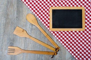 utensils for cooking wood with a small blackboard