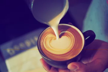 Fotobehang Koffiebar cup of coffee latte in coffee shop vintage color