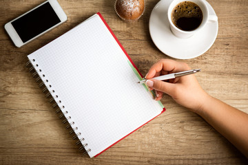 Making notes on coffee break