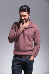 Fototapeta premium young fashion man scratching his beard