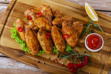 fried chicken wings with red sauce
