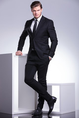 elegant business man holding one hand in his pocket
