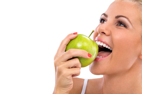 woman eat green apple