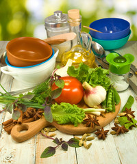 image of different herbs, tomato, oil, spices
