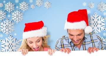 Composite image of young festive couple