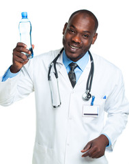 Portrait of a smiling male doctor holding bottle of water on whi