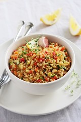 Quinoa salad with vegetables,herbs and lemon.