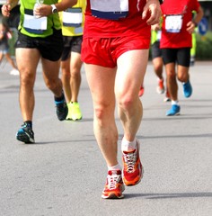 Fototapeta na wymiar athletes of various nationalities run fast Marathon in the stree