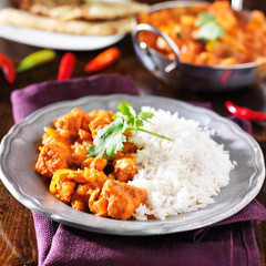 indian chicken vindaloo curry with basmati rice on plate
