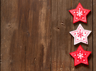 Christmas red and white stars on wooden background