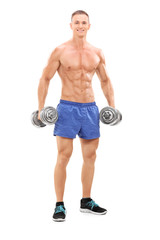 Male bodybuilder holding two barbells