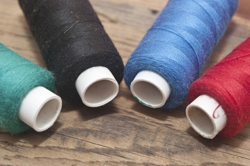 Sewing accessories on wooden background