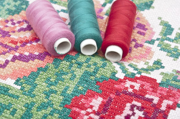 Cross-stitch set: colorful threads and canvas
