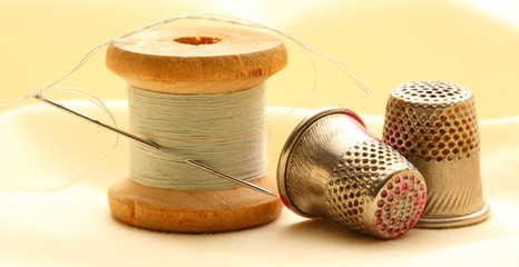 Thread bobbins and sewing thimbles