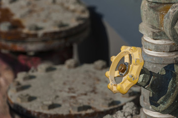 old rusty industrial tap water pipe and valve
