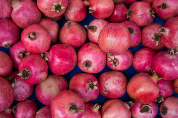 group of pomegranates.  pomegranate closeup, background